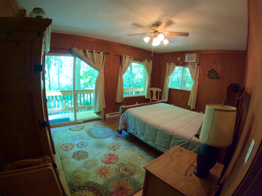 Eagle's Nest Cabin:Bedroom 1 with access to deck and hot tub